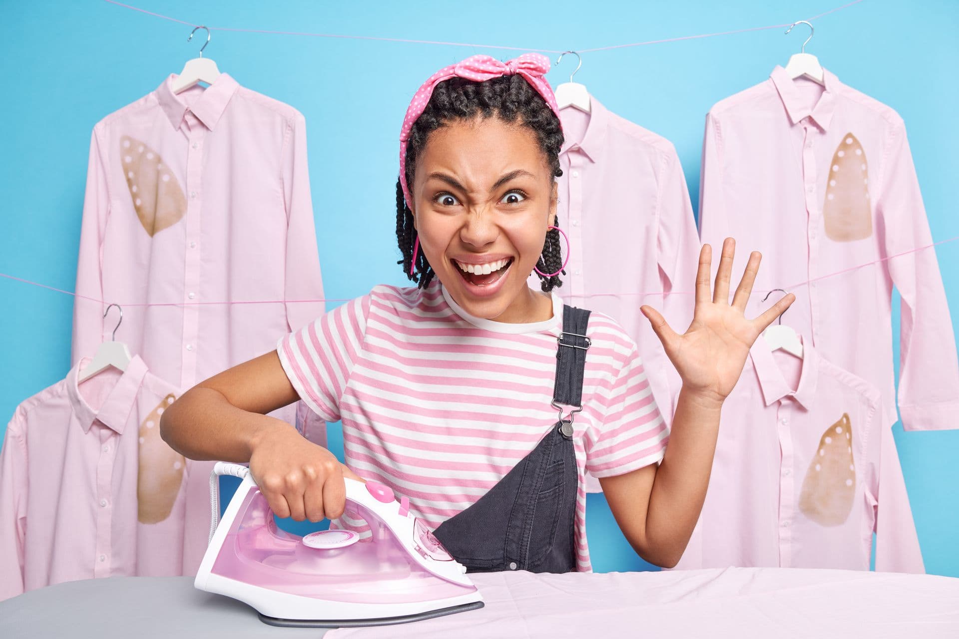 A Sparkllex team member ironing shirts